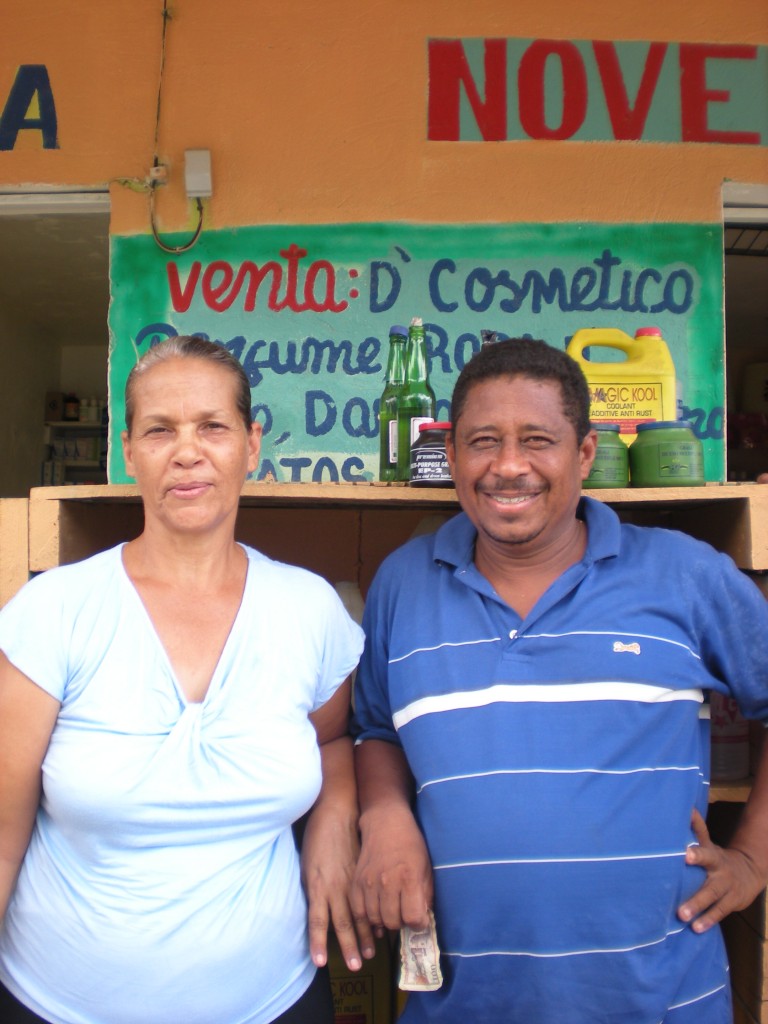 Delsa and her husband in front of their store
